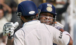 Sachin Tendulkar greets Gautam Gambhir for completing a century in Ahmedabad