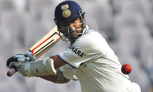 Tendulkar plays a shot on the fourth day of their first test cricket match in Nagpur.