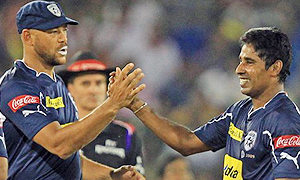 Symonds greets his teammate C.Vaas after dismissal of Yubraj Singh of Kings XI Punjab.